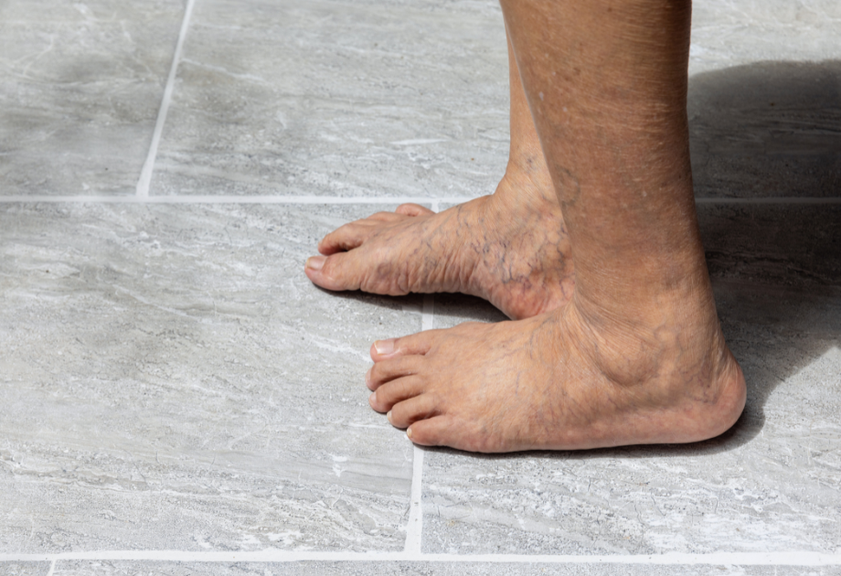 elderly person standing on tile